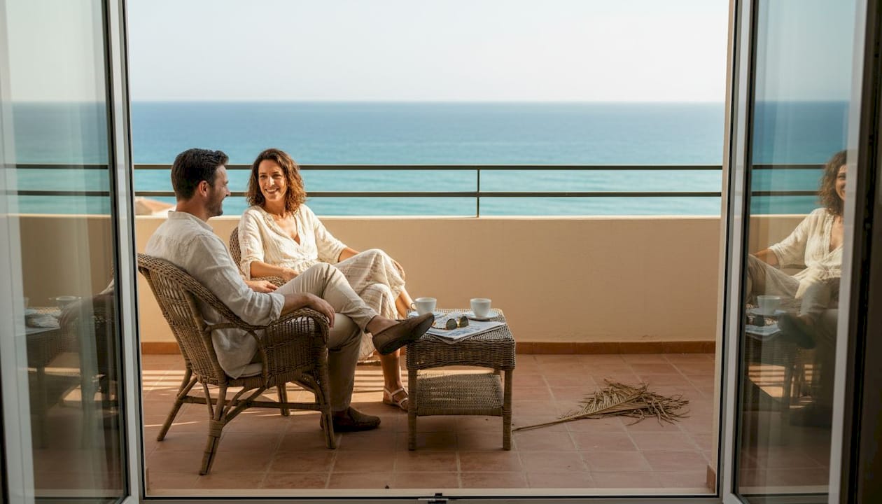Couple enjoying Costa Dorada sea view terrace