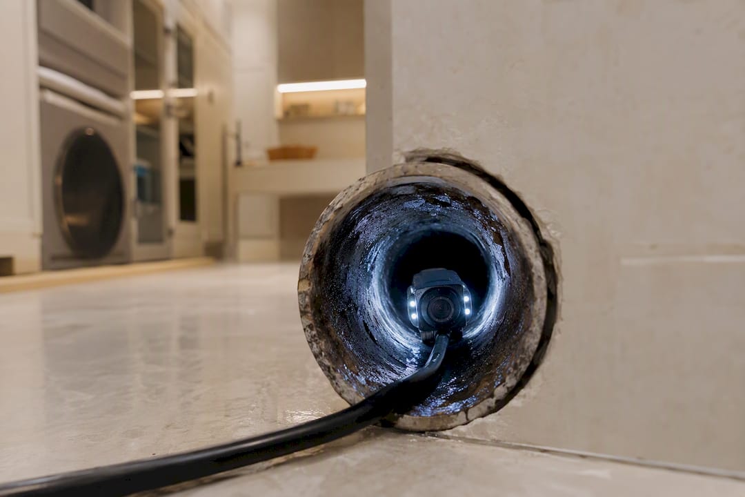 Close-up sewer camera inside luxury home plumbing pipe