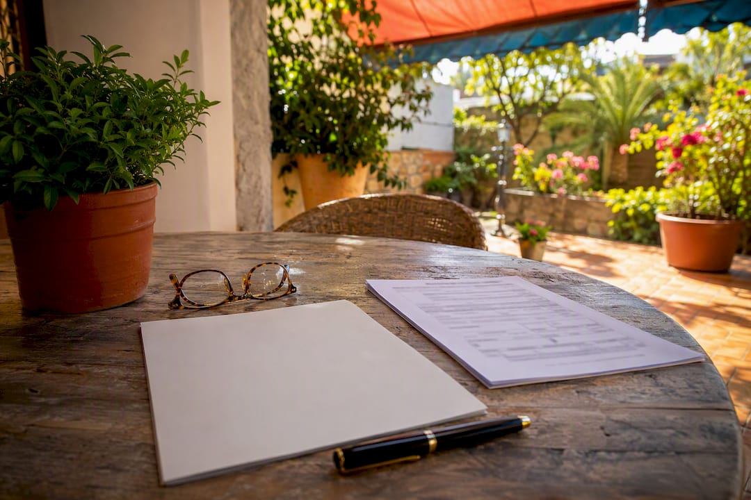 Notary deed and Spanish tax form on table